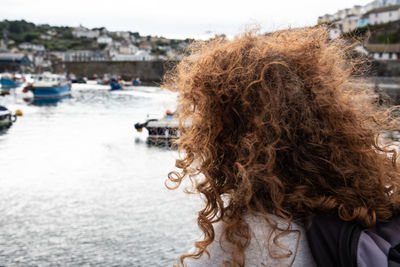 Rear view of woman with curly hair