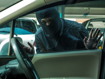 Man sitting in car