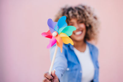 Close-up of woman with colorful balloons