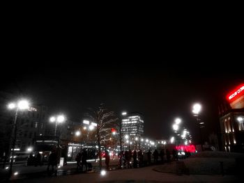 Cars on road in city at night