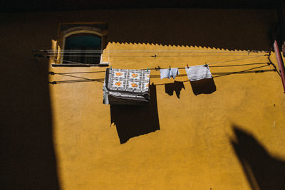 Clothes drying against building