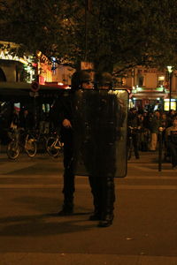 People on street in city at night