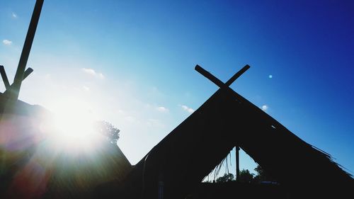 Low angle view of silhouette built structure against sky