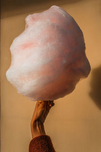 Close-up of hand holding ice cream