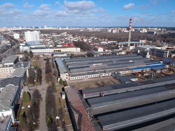 High angle view of buildings in city against sky