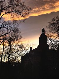 Low angle view of building against cloudy sky