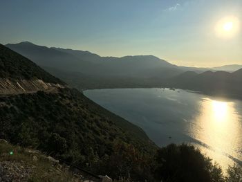 Scenic view of lake against sky during sunset