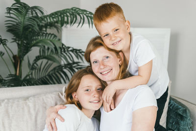 Portrait of mother and daughter at home