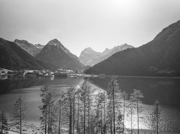 Scenic view of lake and mountains against sky