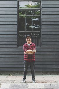 Full length portrait of boy standing outdoors