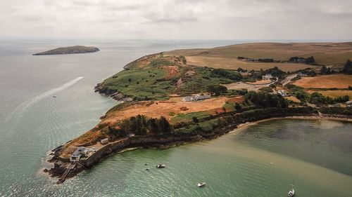 High angle view of bay on shore against sky