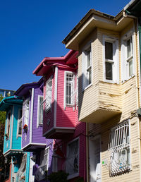 Low angle view of buildings against blue sky