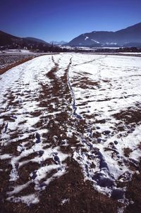 Scenic view of snow covered mountain against sky