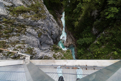 High angle view of water flowing through rocks