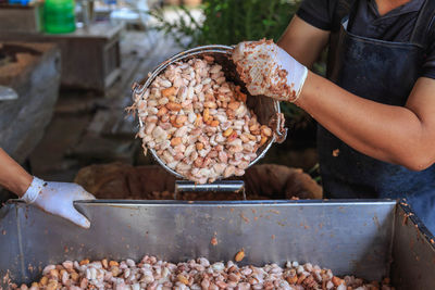 Midsection of person preparing food