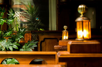 Close-up of illuminated candles on table