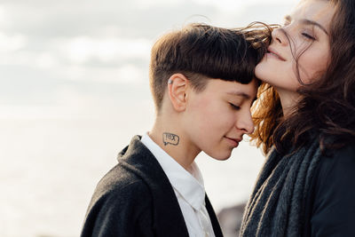 Portrait of couple kissing outdoors