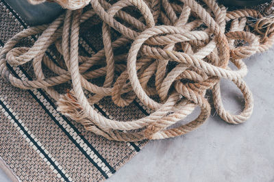 High angle view of rope tied on metal