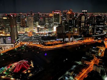 High angle view of illuminated buildings in city at night