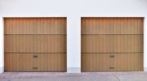 Two brown garage roller doors