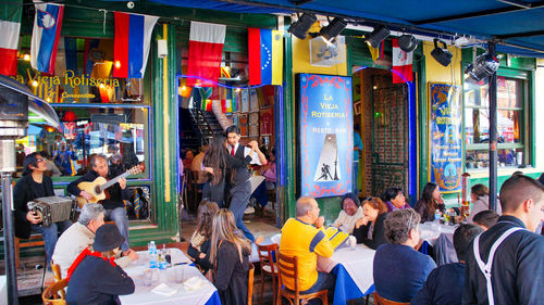 People at market stall in city