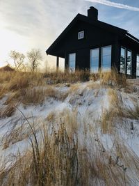 House by sea against sky