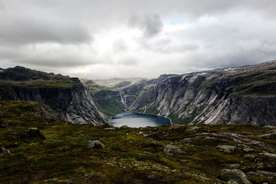 Scenic view of waterfall against sky