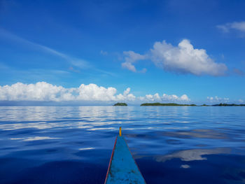 Scenic view of sea against blue sky