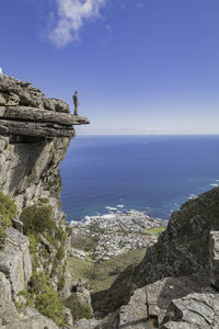 On the edge of a ledge on table mountain. kasteelpoort.