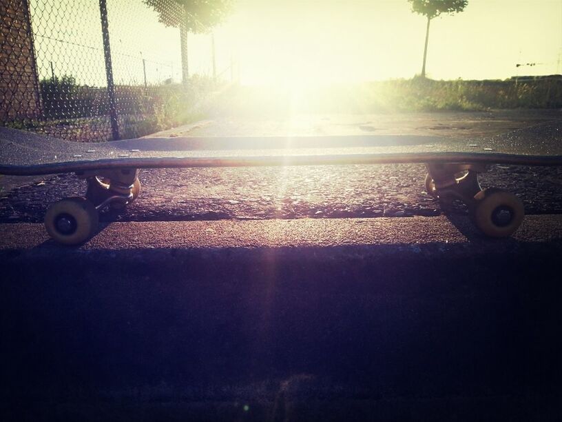 transportation, land vehicle, sun, mode of transport, sunlight, sunbeam, bicycle, lens flare, car, day, outdoors, sky, stationary, sunny, no people, field, grass, metal, close-up, fence