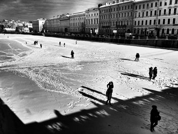 People walking on road in winter