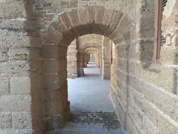 View of historic building seen through arch