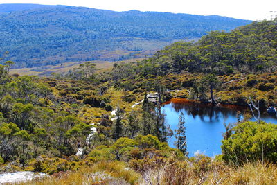 Scenic view of lake and mountains against sky