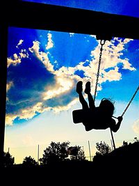 Low angle view of silhouette trees against sky at sunset
