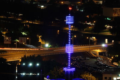 Illuminated city street at night