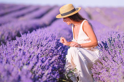 Woman standing on lavender field