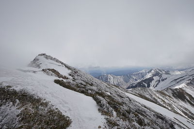 Scenic view of mountains against sky