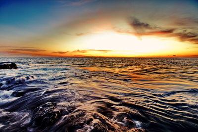 Scenic view of sea against sky during sunset