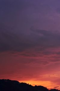 Low angle view of dramatic sky during sunset