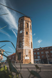 Low angle view of building against clear blue sky