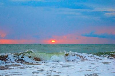 Scenic view of sea at sunset