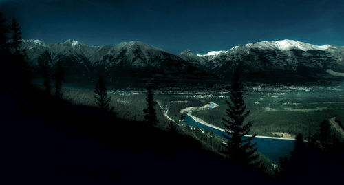 Scenic view of mountains in winter at night