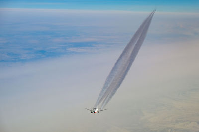 Low angle view of airplane flying in sky