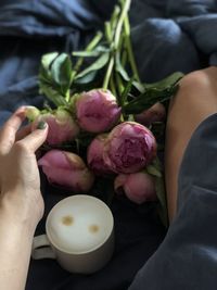 Coffee and flowers in bed