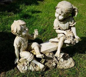 High angle view of statue sitting on grass