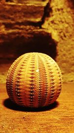 Close-up of ball on wooden table