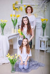 Happy mother's day. daughters congratulate their mother on women's. family holiday and togetherness.