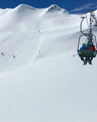 Ski lift on snowcapped mountain in lech 