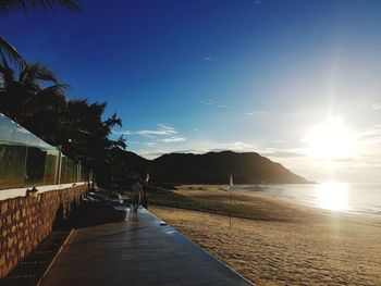 Scenic view of sea against clear sky during sunset