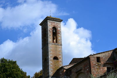 Low angle view of bell tower against sky